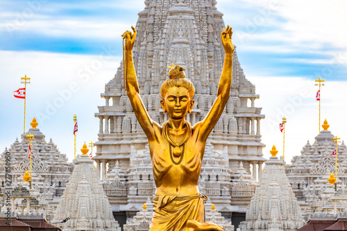 Statue of Nilkanth Varni with Akshardham Mahamandir temple in the back photo