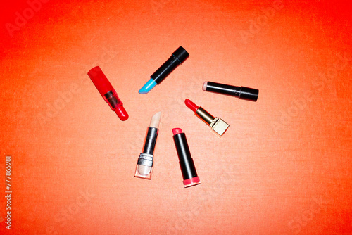 Lipsticks with different shades with hard direct flashlight photo