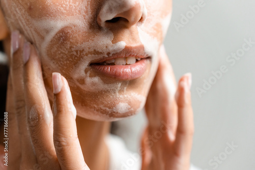A woman's face in a wash foam photo
