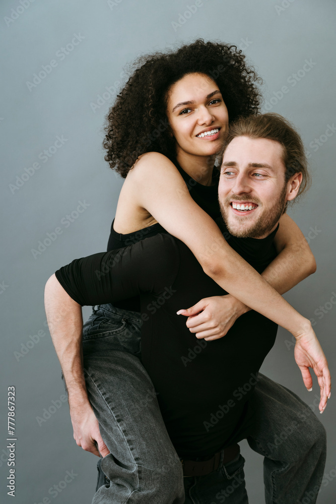 Lifestyle portrait of smiling modern couple.
