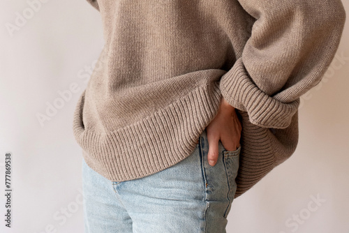 Woman wearing oversize woolen jumper photo