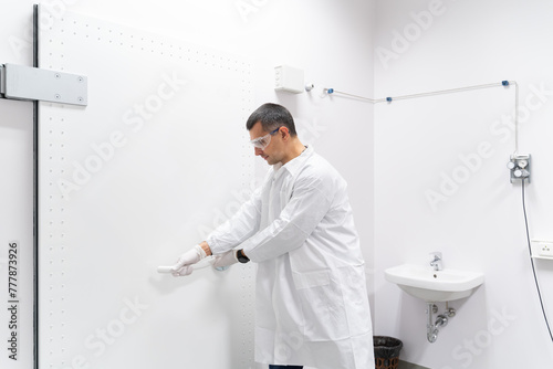 Scientist Closing The Swing Door In Technology Lab photo