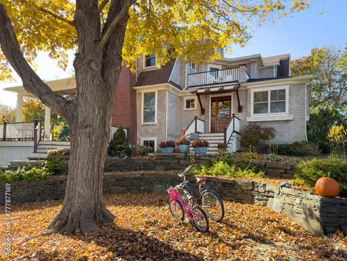 House exterior door in Autumn with  bike pair in fall foliage  photo