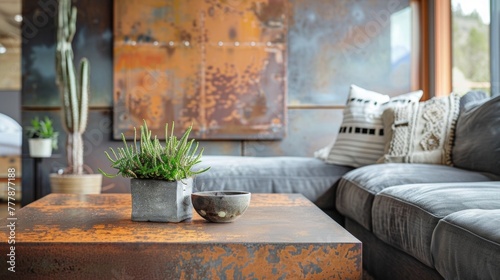 One of the focal points of this sustainable living room design is the use of oxidized metal accents throughout the space. The coffee table made from recycled steel and featuring a .