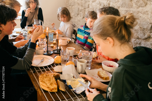  festive family breakfast at rustic table photo