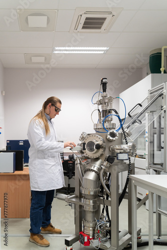 Scientist Working With Pulsed Laser Deposition System (PLD) photo