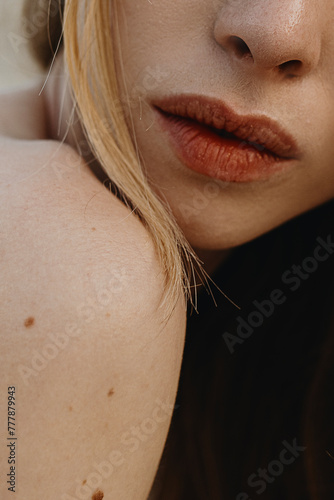 Close-up sensual woman's big plump lips of anonymous woman  photo