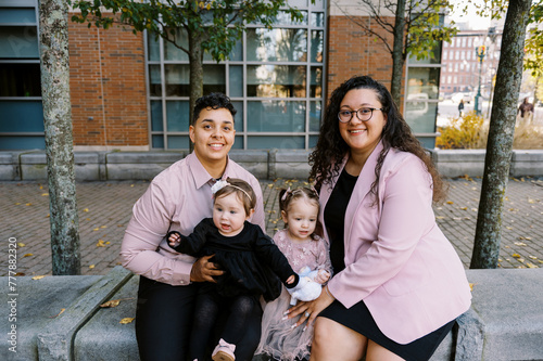 smiling happy mothers with their children on adoption day photo