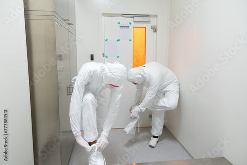 Two Anonymous Researchers Putting Safety Clothing photo