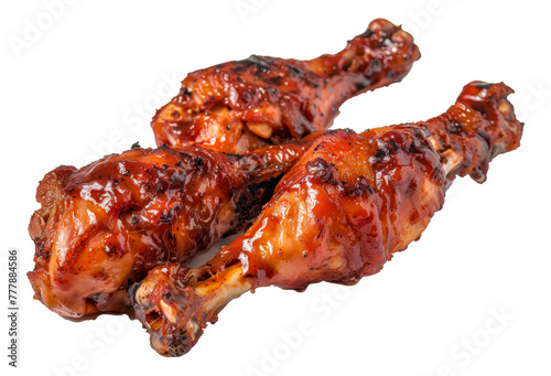 Two pieces of chicken with barbecue sauce on them, cut out - stock png.