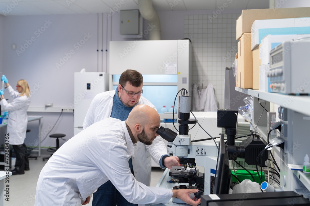 Researchers Working In Laboratory- Researchers Working In Laboratory-