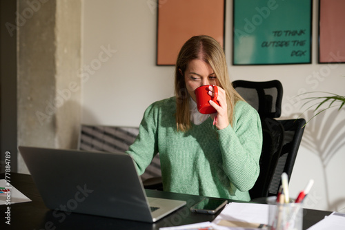 Professional Woman with Coffee working at home photo