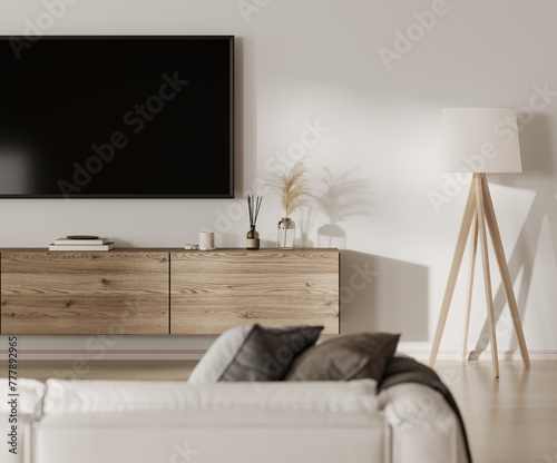 Home interior with TV screen and console table with decor, white sofa photo