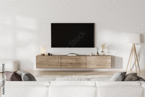 Living room interior with TV screen in front of couch. home interior photo