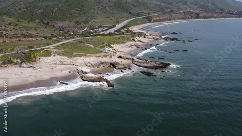 Aerial drone footage tracking along the beach at Leo Carrillo state beach, Malibu, CA photo