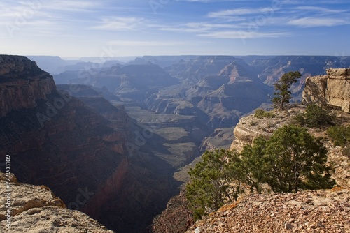 The Grand Canyon, Arizona, with white clouds in a blue sky.