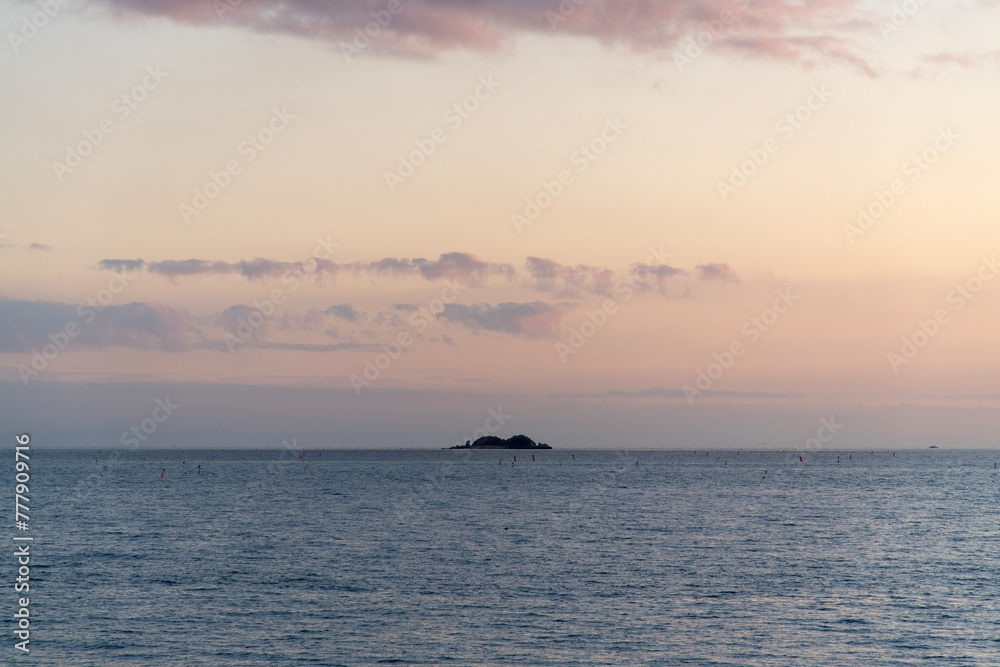 Seascape with the island during sunset