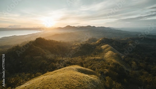 aerial philippines hill landscape nobody wild nature with green tropic forest abudant plant high grass lush mosses beautiful asian landmark natural wonder cinematic shooting in drone shot