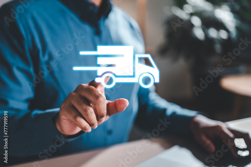 logistic, trade, storage, import, factory, lorry, shipment, container, heavy, deliver. A man is holding a truck icon in his hand. The truck is moving, and the man is pointing at it.
