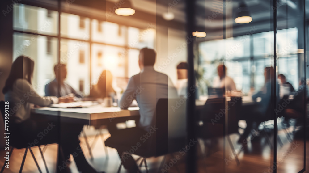 Blurry Office Meeting Through Glass Wall: Focusing on Corporate Teamwork and Workplace Dynamics.