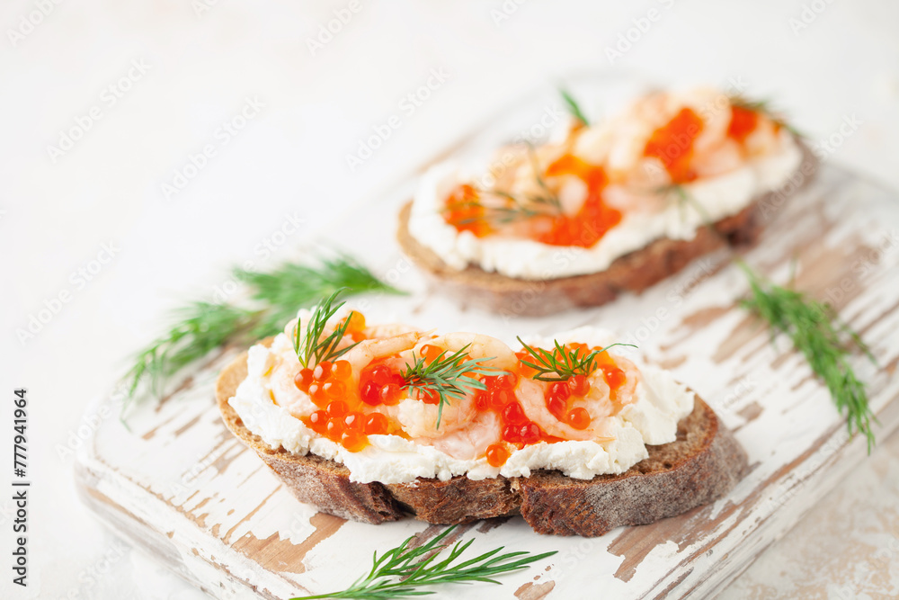 Toast skagen - shrimps and red caviar on bread. Classic swedish sandwich. Toast skagen - shrimps and red caviar on bread. Classic swedish sandwich.