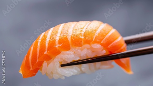 Chopsticks delicately grasp a piece of sushi meat in a close-up. Generative ai