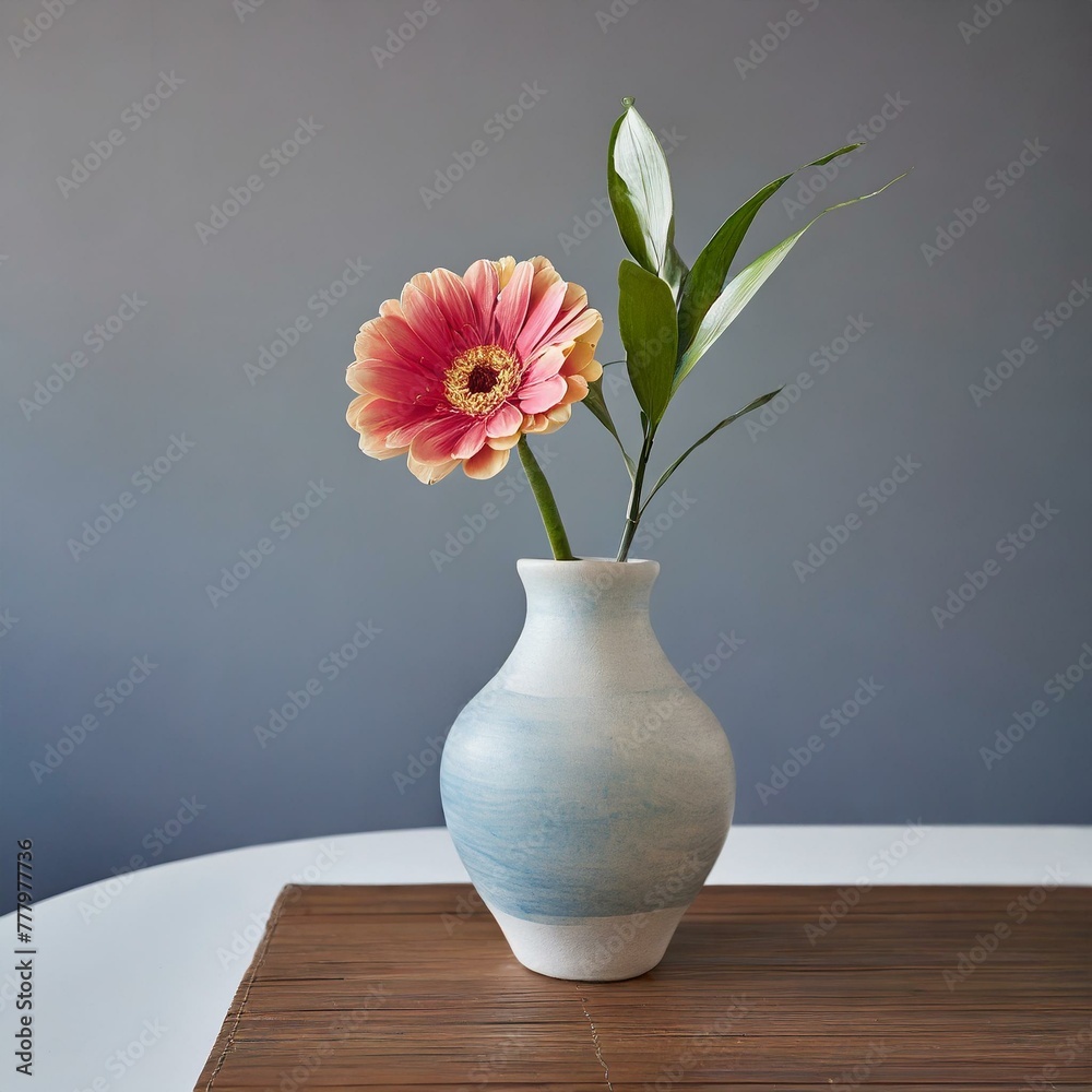 vase with flowers.an elegant and minimalist house decoration piece featuring a sleek ceramic vase with a single, striking flower arrangement. The composition should emphasize clean lines and subtle so