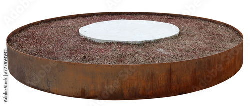 Rusty round iron flower bed with dry grass isolated