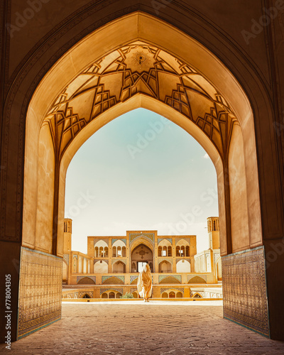 Kashan, Iran - 29th may, 2022: Tourists and pilgrims explore sightseeing beautiful Agha Bozorg Mosque photo