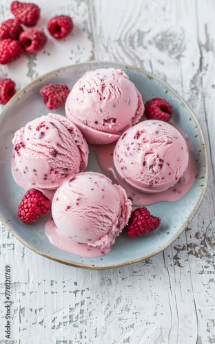 Scoops of Raspberry Ice Cream on a Ceramic Plate Adorned With Fresh Berries