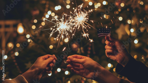 A festive snapshot of hands holding sparklers photo