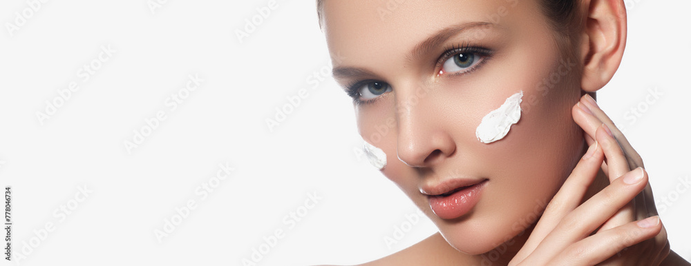 Fototapeta premium High-quality crop photo of skincare and cosmetics concept with copy space for text. Woman with beautiful face touching healthy facial skin portrait. Beautiful happy Asian girl model with natural