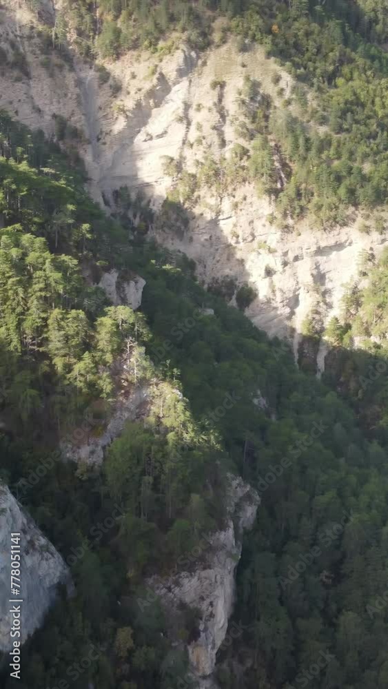 Aerial panoramic view of forest on rocky mountain slope - Ai Petri, Yalta, Crimea. Abstract aerial nature forest and mountains. Weather and Climate Change. Vacation, travel and holiday concept Aerial panoramic view of forest on rocky mountain slope - Ai Petri, Yalta, Crimea. Abstract aerial nature forest and mountains. Weather and Climate Change. Vacation, travel and holiday concept