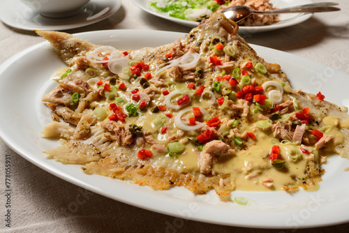 Skate Wing or Ray Wing Prepared Whole with Tuna Mayonnaise Sauce and Red Bell Pepper