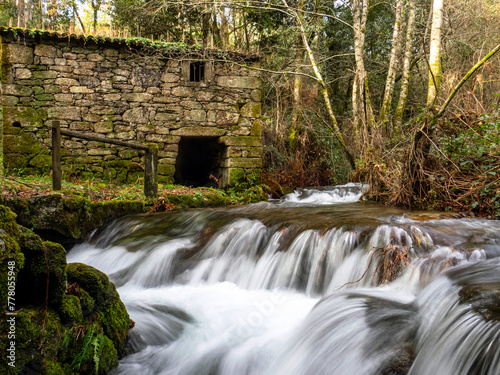 Mill with a river with silk water in the Molinos da Rocha ethnographic park. Arbo, Galicia, Spain.