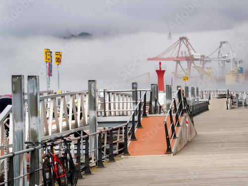 View of the port of Vigo and its estuary covered by a large fog bank. Rias Baixas, Galicia, Spain. photo