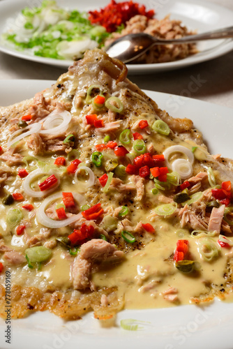 Skate Wing or Ray Wing Prepared Whole with Tuna Mayonnaise Sauce and Red Bell Pepper