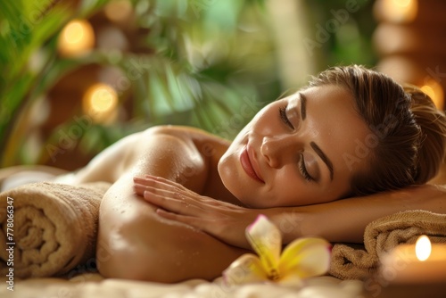 Beautiful young woman relaxing on massage spa treatment