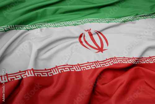 waving colorful national flag of iran. © luzitanija