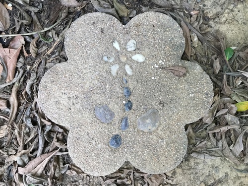 stone flower on the floor in garden