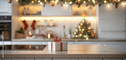 Christmas presents on the table. Kitchen with Christmas decorations and wrapped gift on kitchen island  blurred background. Christmas elements.