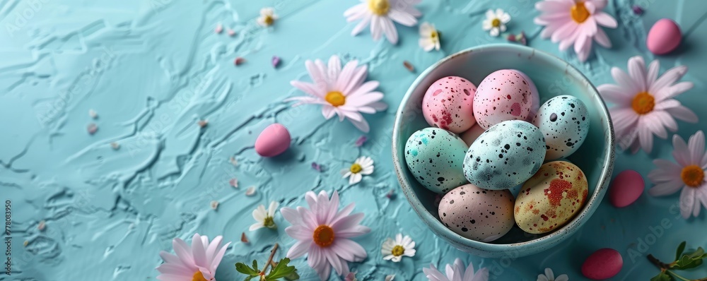 Colorful Easter eggs with willow branches and flowers on a blue background