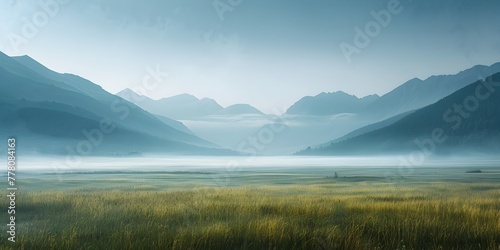 Misty Mountain Meadow at Dawn Peaceful Scenic Landscape with Faint Silhouette of High Peaks Through the Haze © Thares2020