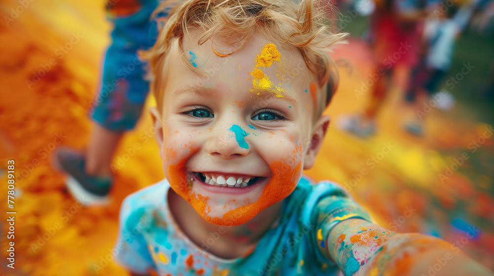 Cheerful boy at the festival of colors Holi Cheerful boy at the festival of colors Holi