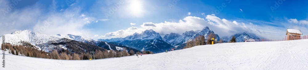 Wide panoramic view of winter landscape with snow covered Dolomites in Kronplatz, Italy Wide panoramic view of winter landscape with snow covered Dolomites in Kronplatz, Italy