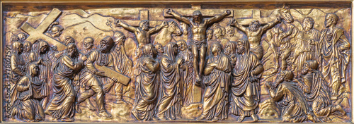 MILAN, ITALY - MARCH 4, 2024: The the relief of Crucifxion  in the church Basilica di Santo Stefano Maggiore by unknown artist.