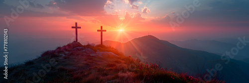 Three crosses on the top of the mountain at sunrise , crosses stuck in the sand on an orange background 
