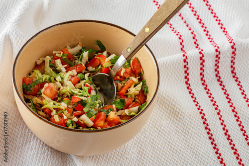 prepeared at home vitamin vegetable salad in ceramic bowl close up photo