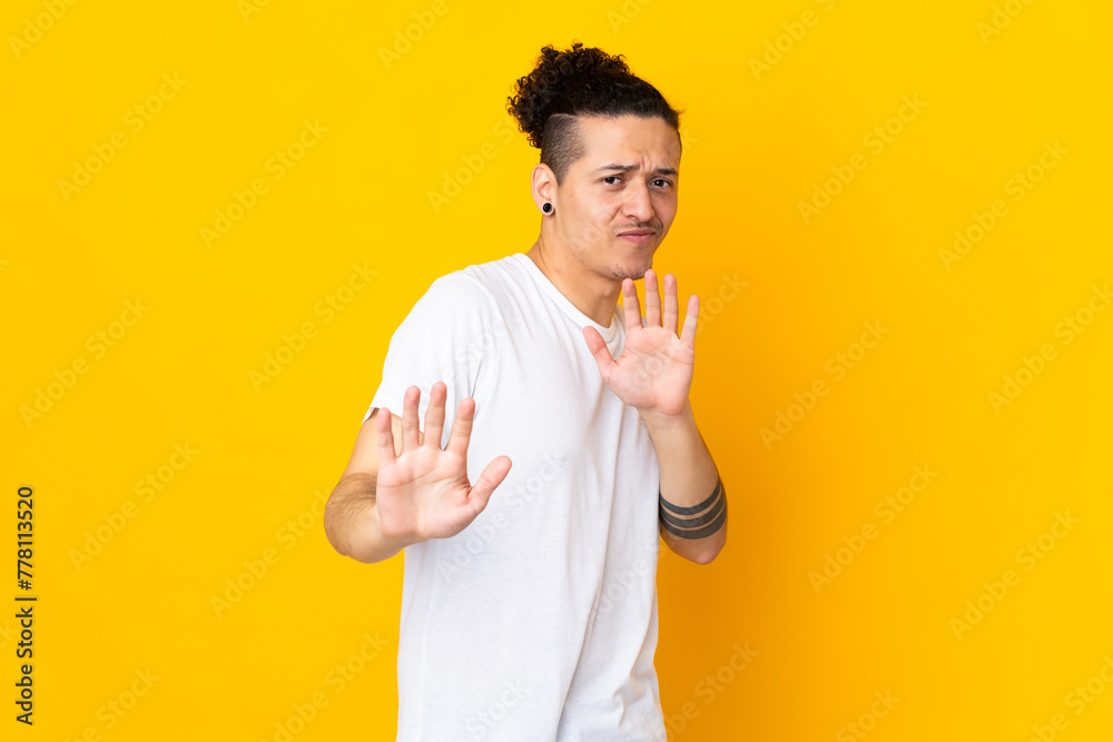 Caucasian man over isolated background nervous stretching hands to the front Caucasian man over isolated background nervous stretching hands to the front