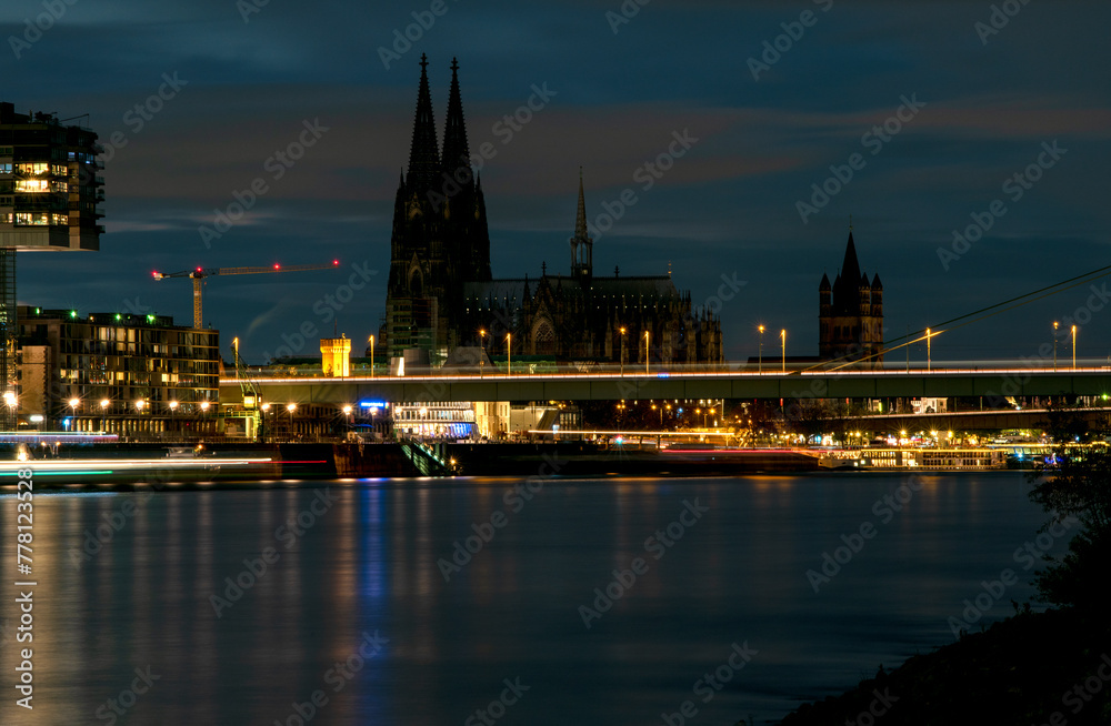 Night view on the banks of Rhine river in Cologne, Germany